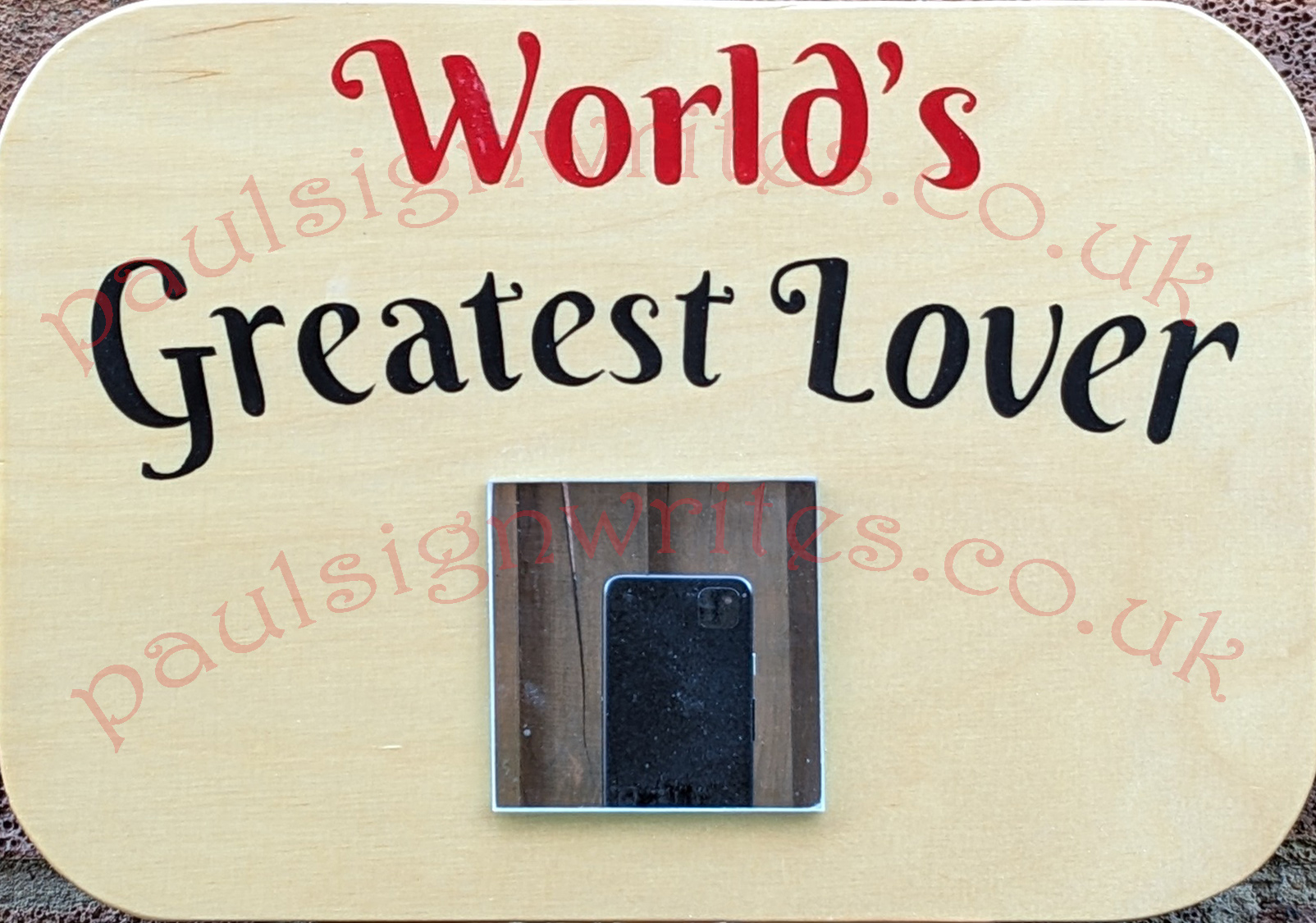 World's Greatest Lover The 'World's Greatest Lover' signwritten in red & black, with a 75mm2 mirror to capture their image on a maple panel.